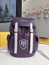 Load image into Gallery viewer, Front view of the purple and silver Omega Lamplighters Legacy Backpack with crest and embossed LAMP pattern.