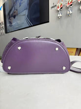 Load image into Gallery viewer, Bottom view showing the purple base and four metal feet.